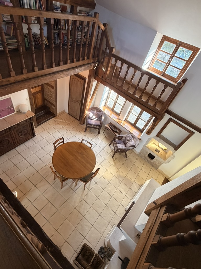 View from the upper landing down into the beamed living room