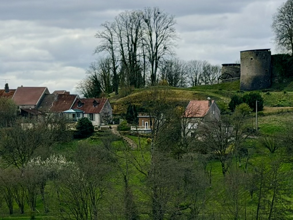 The village on the hill with the old stone tower above the houses