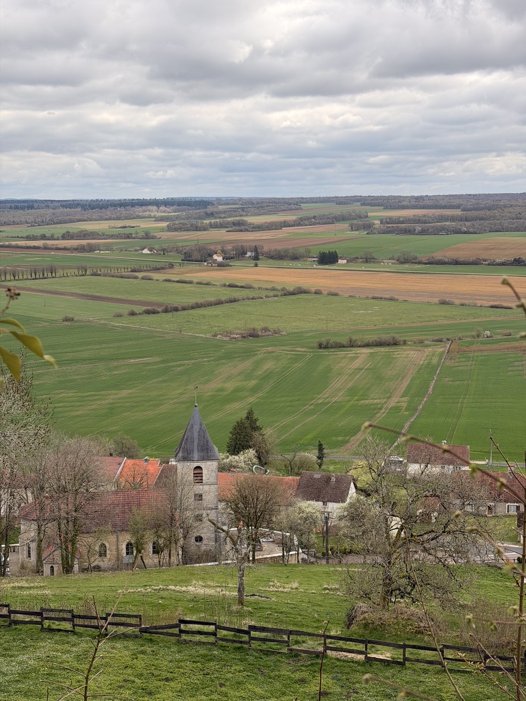 The village church and open farmland stretching to the horizon
