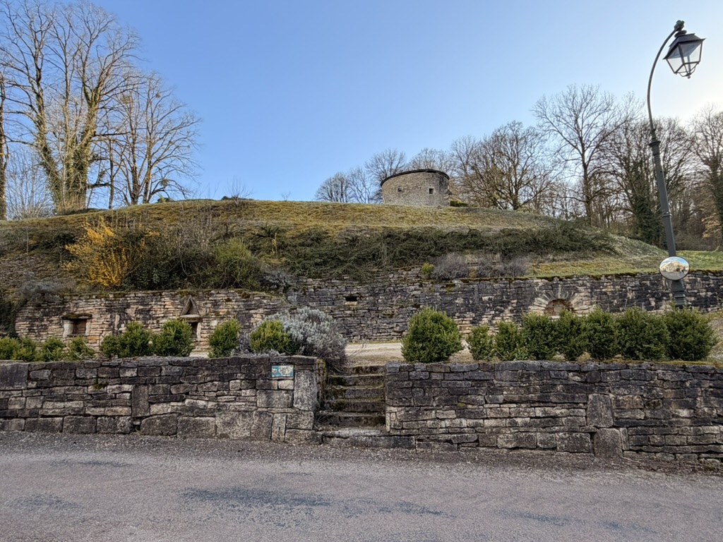 Terraced stone walls below the old tower on the hill